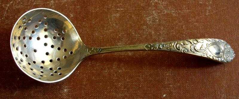 ONE SILVER PLATED LADLE SPOON ORNATE HANDLE amp HOLES IN THE BOWL ABOUT 5 12 INCH