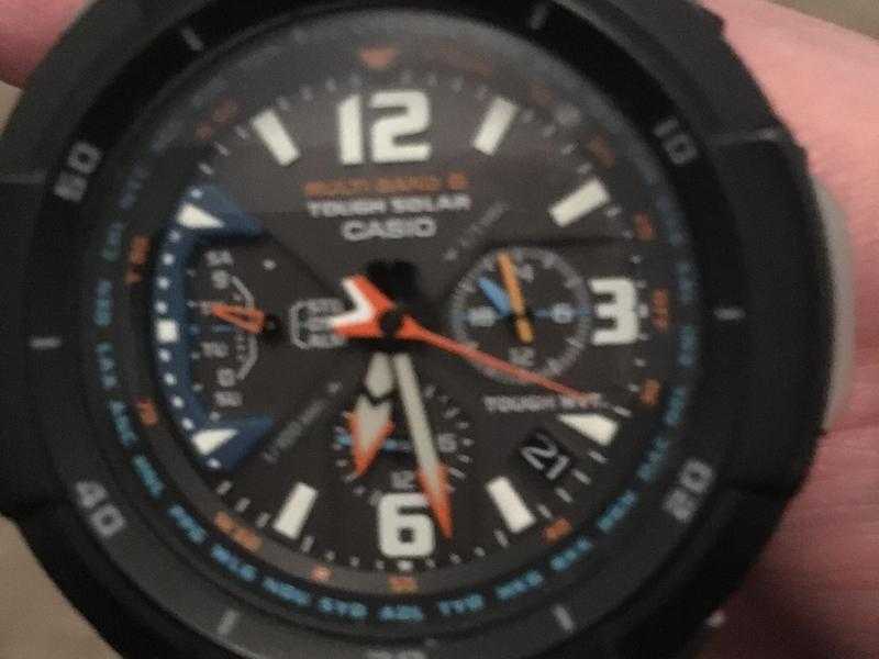 Orange strapped Casio G shock watch solar powered