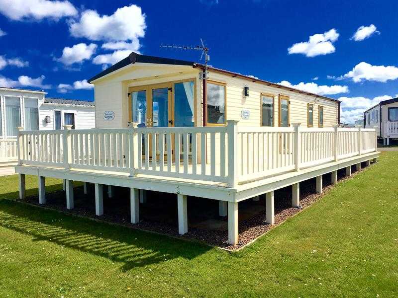 OUTSTANDING HOLIDAY HOME ON STUNNING SEA FRONT PARK WITH DIRECT BEACH ACCESS