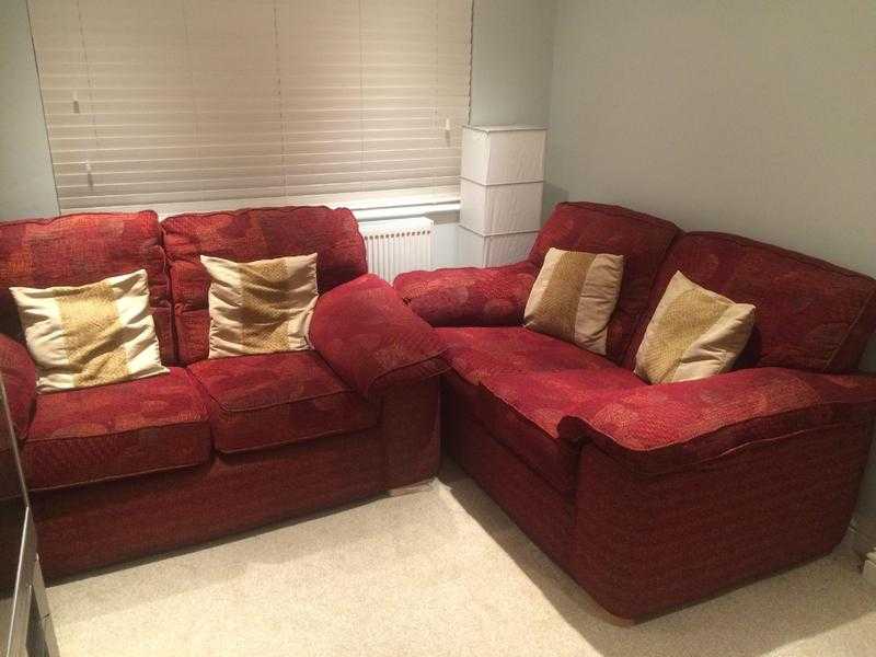 pair of 2 seater maroon sofas