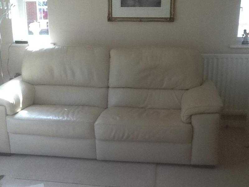 Pair of Cream reclining leather settees with matching pouffe