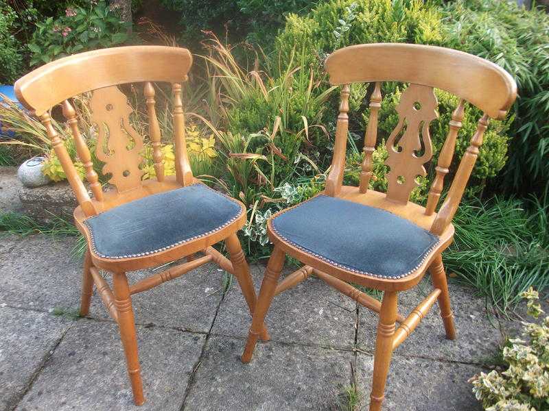 pair of stable solid heavy dining chairs ideal for christmas guests or up cycle