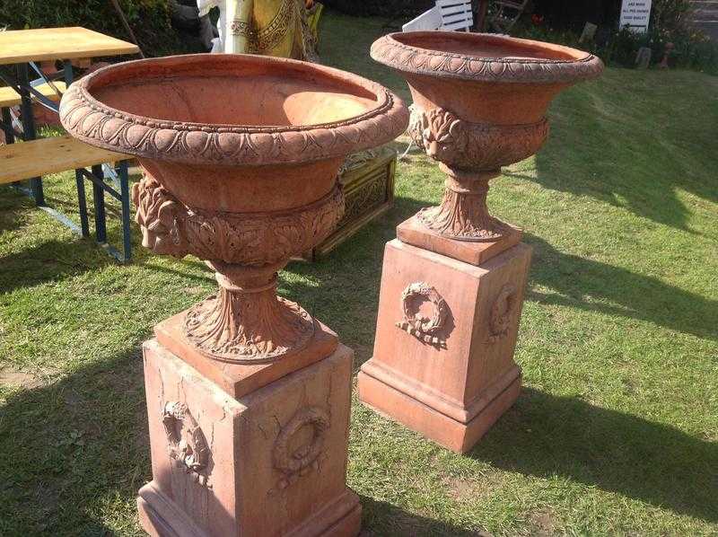 PAIR OF TERRA COTTA GARDEN URNS AND PLINTHS