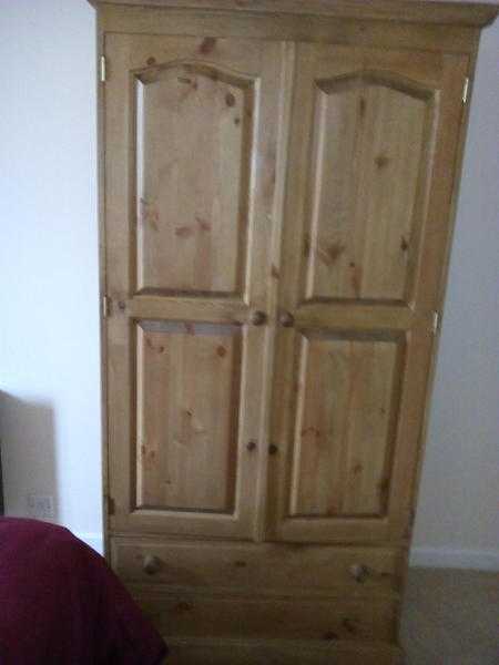 pair of waxed pine wardrobes