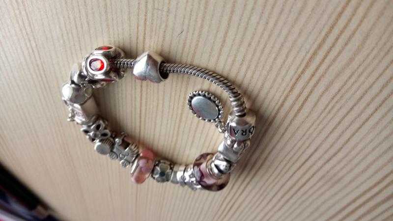 Pandora charm bracelet with most charms