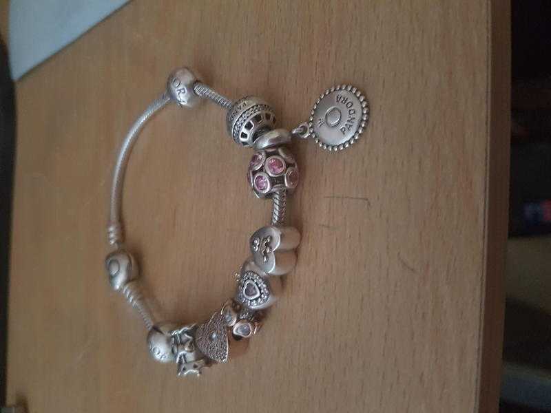 PANDORA HEART BRACELET WITH 8 CHARMS AND TWO STOPPERS PRICE REDUCED