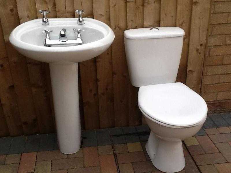 Pedestal basin with taps, toilet and matching bath taps