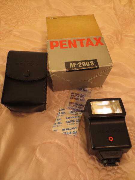 Pentax flash unit-good condition, in original box amp packaging.