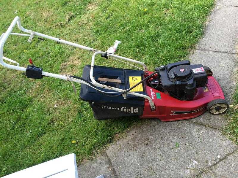 Petrol mountfield lawnmower in working condition for sale