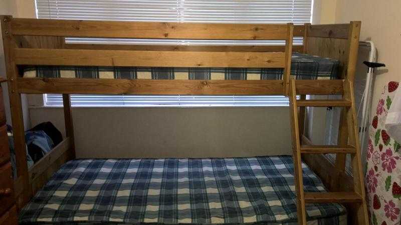 Pine Bunkbeds- single on top and double on the bottom.