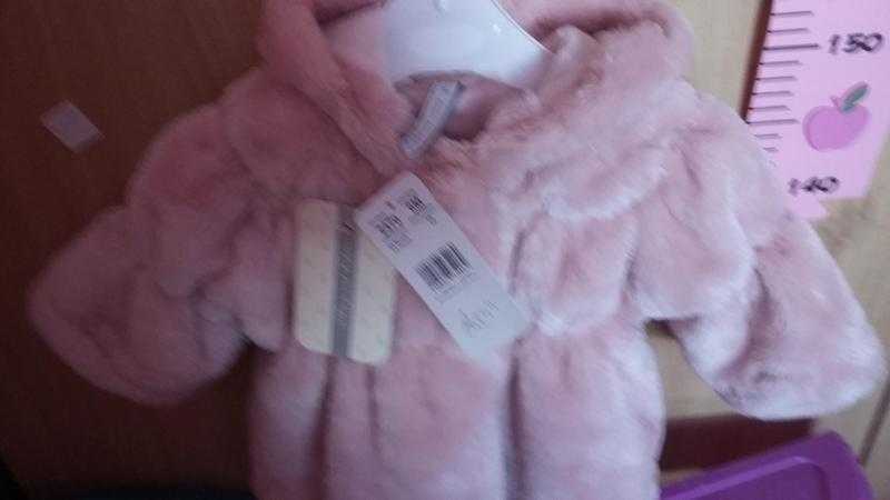 Pink baby fur coat with hood never been worn price tag still on  43.99 sell for  20