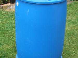 Plastic Barrels with lids, filled with plastic flower pots and seed trays