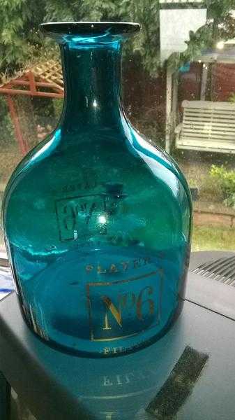 Players no 6 water flask as used in a public house  bar. Bright blue.