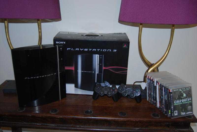 Playstation 3, 2 x dual shock controllers and 12 games