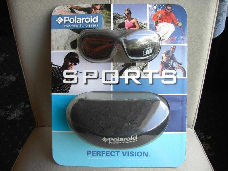 POLAROID SPORTS SUNGLASSES, P7215B, GUNMETAL amp ORANGE  CASE, BRAND NEW in ORIGINAL POLAROID PACKET