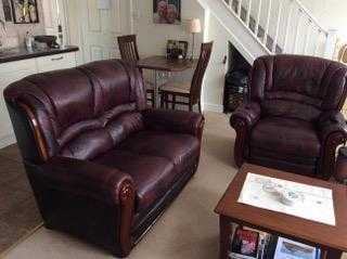 Power relaxer chair and small two seater settee, dark red leather in nearly as new condition