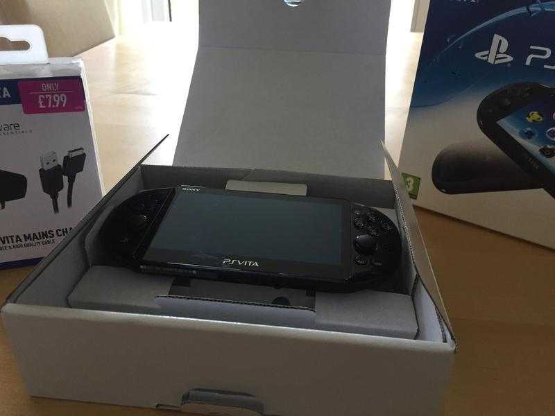 PS Vita as new in original box with brand new charger