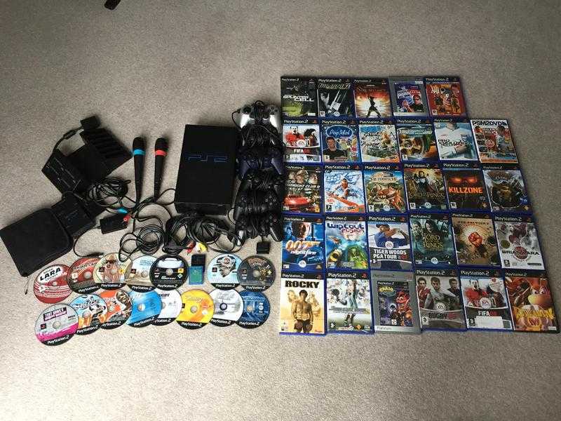 PS2 console and 40 games including Singstar play - Play Station 2