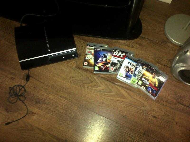 ps3 console with 2 controlls and 6 game s pes 216 pes 2013 ufc 3 F1 2010 ufc 2010 world championship