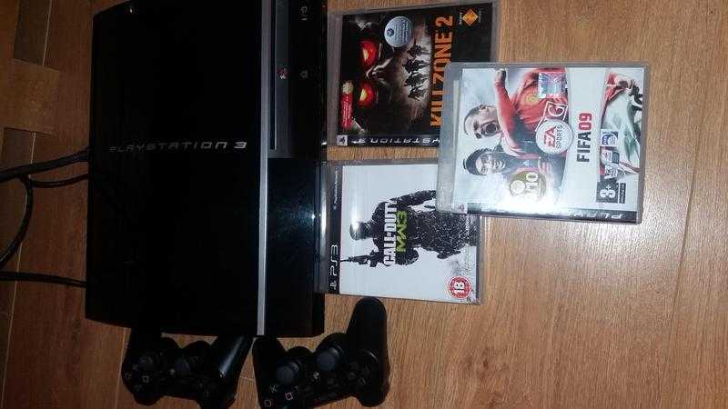 PS3 with 2 dual shock joysticks and 3 games