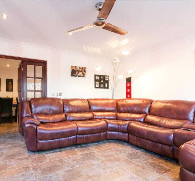Real leather corner sofa with electric recliner
