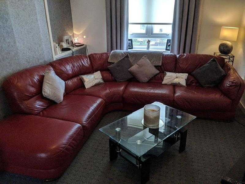 Red leather corner suite and swivel chair