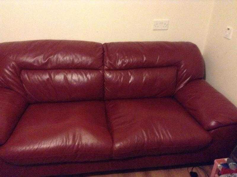 Red leather sofas, 3 seater  2 seater. In need of repair as spring pockets are broken.Open 2 offers