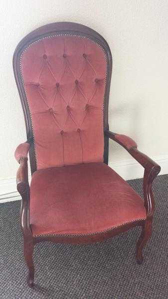 Red velvet upholstered vintage chair