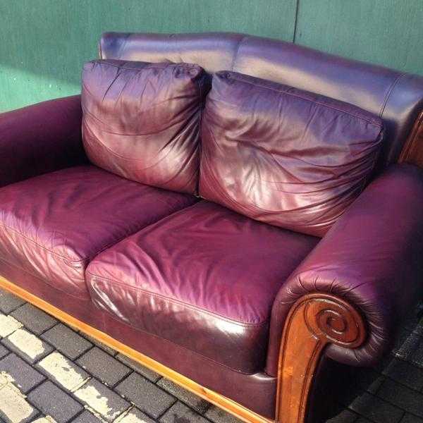 REDUCED  LEATHER HIDE OXBLOOD SETTEE  LOVELY SHAPE