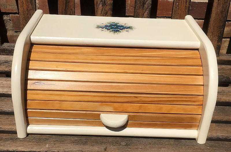 Reloved pine rolltop bread bin, painted and decoupaged. Off-white with bluegreen motif.