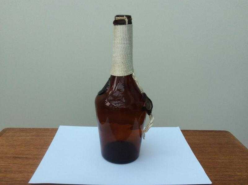 Rope partially covered bottle.