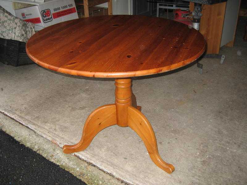 Round pine pedestal dining table