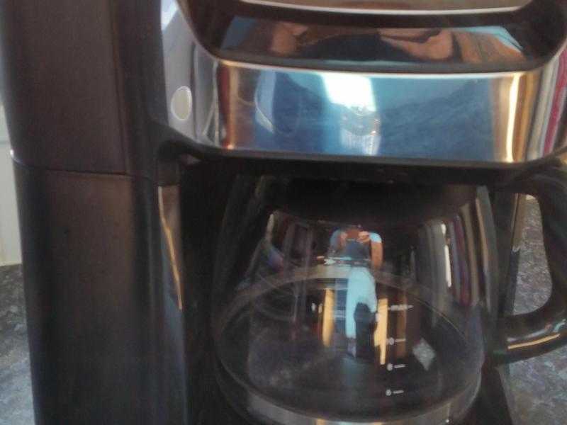 Russell Hobbs coffee machine with inbuilt grinder.