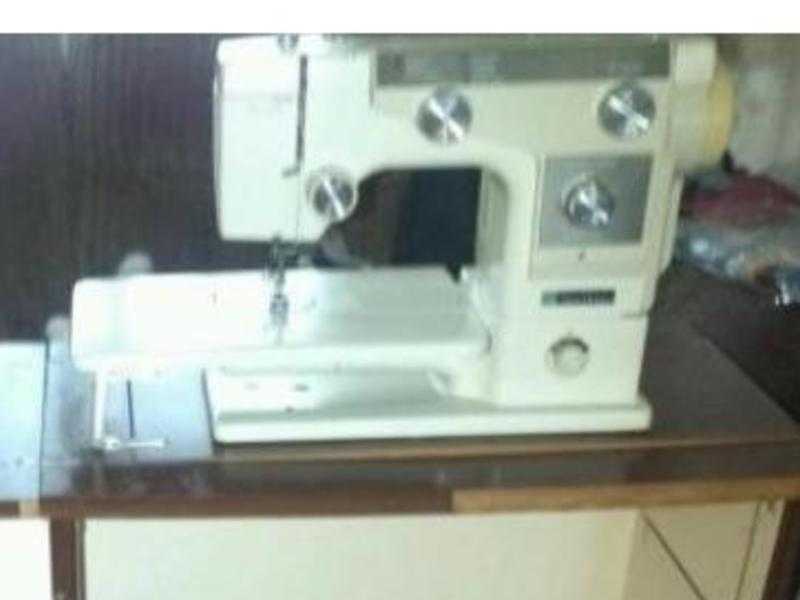 Sewing machine with table