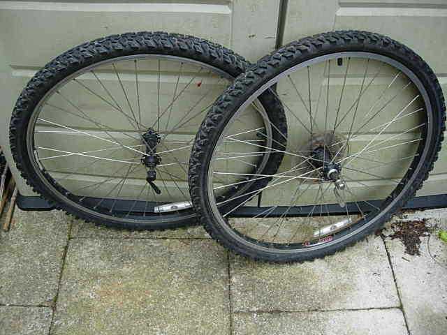 shimano fh-rm40 hubs on matrix rims with 8 speed cassette and tyres, mountain bike wheels