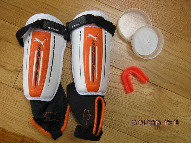 Shin pads and unused mouth guard.