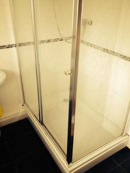 Shower tray and glass enclosure.