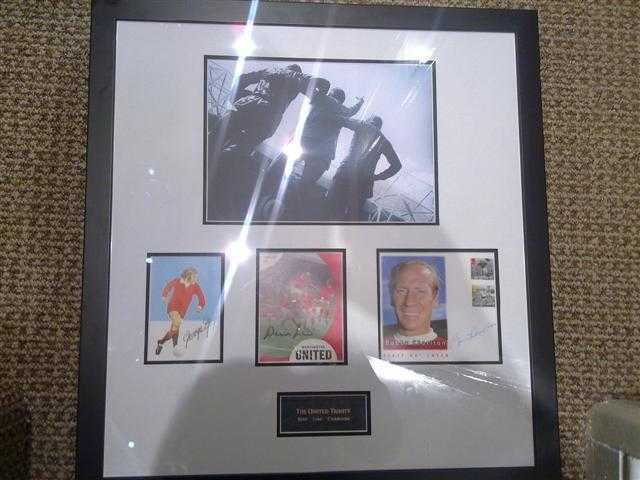 Signed George Best  Sir Bobby Charlton and Denis Law framed picture Autographs