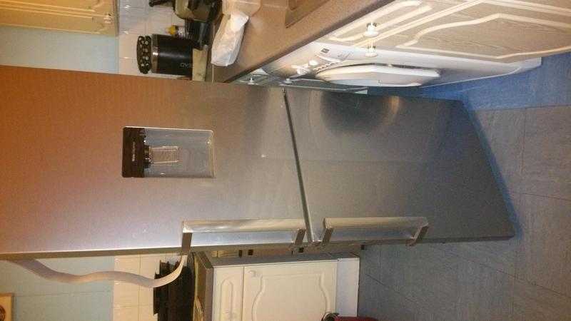 Silver and stainless fridge freezer