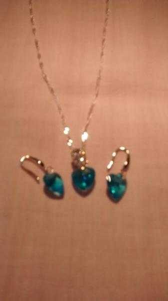 Silver crystal with blue stone necklace and earrings