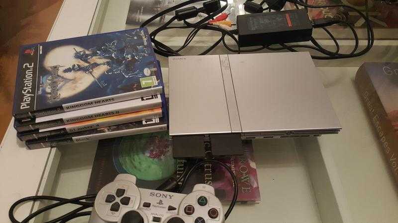 Silver Slimline PS2 console with Games, Controller and Memory Cards