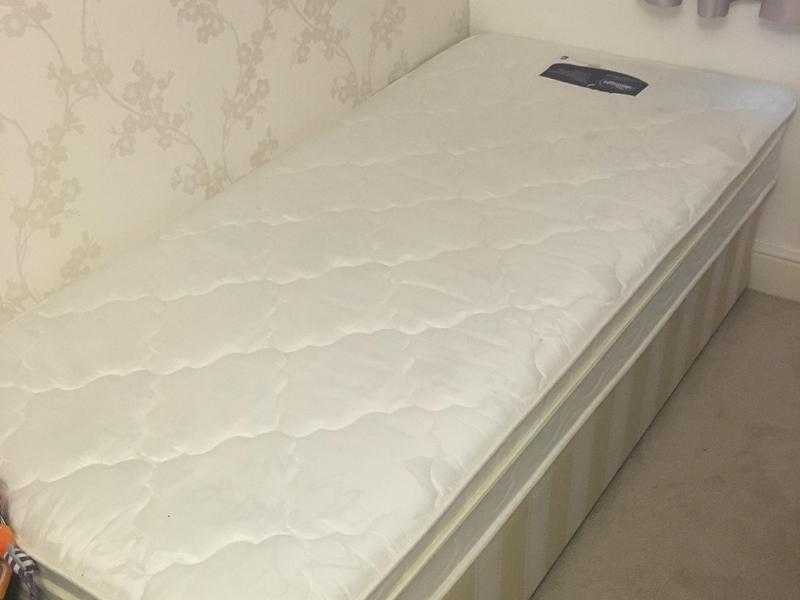 SINGLE BED WITH 7 INCH COIL MATTRESS. USED TWICE. PERFECT CONDITION.