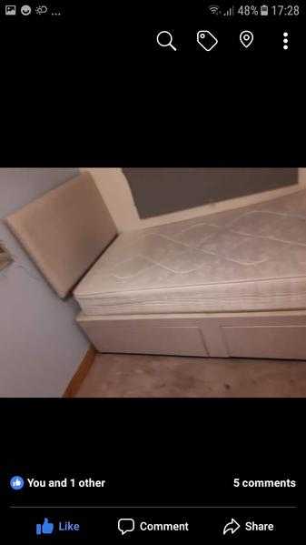 Single bed with drawers and a headboard and mattress