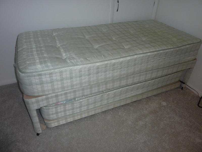 Single bed with guest bed under