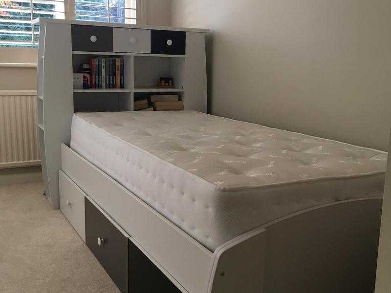 Single bed with mattress.