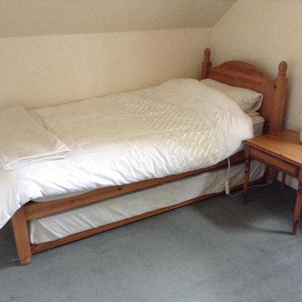 Single bed with mattress bed stored underneath