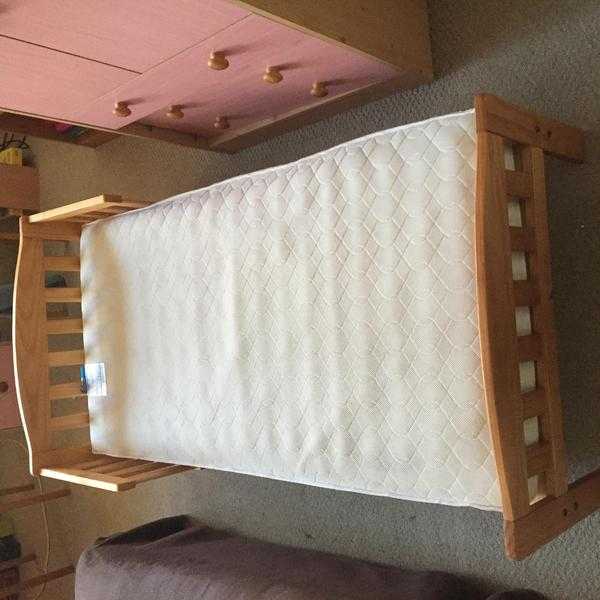 Single bed with mattress for a child.