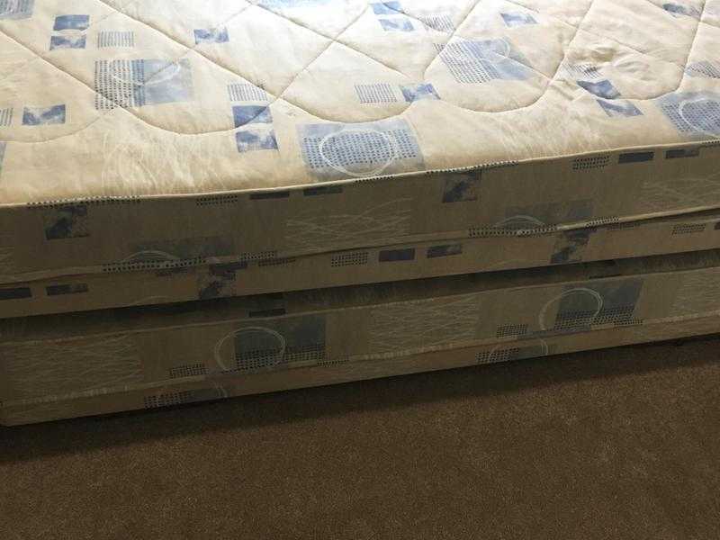 Single bed with truckle bed stored underneath