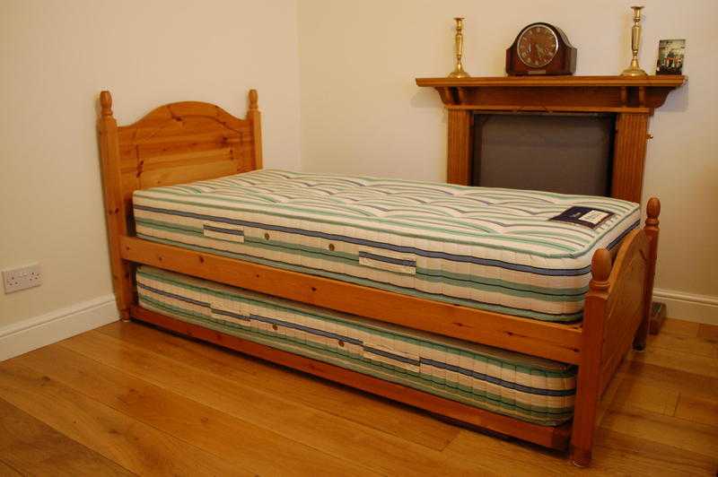 Single bed with trundle guest-bed underneath