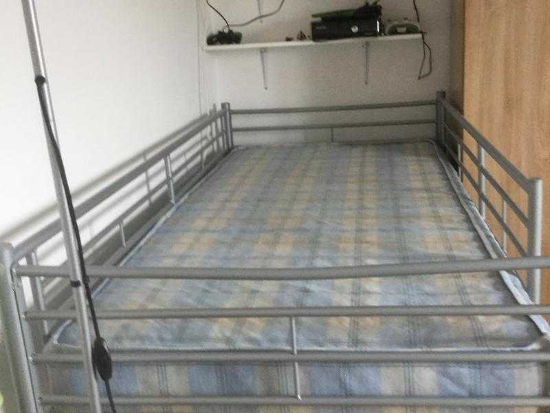 Single high bed with mattress and ladder